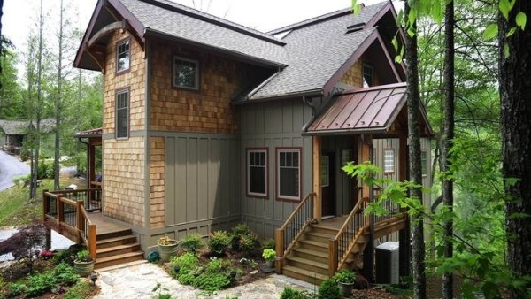A house with steps leading to the front door.